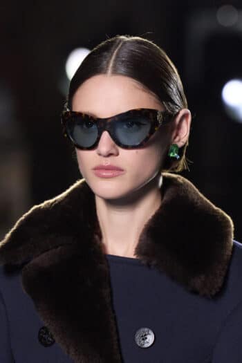 Sunglasses and asymmetric fur trim coat at Tory Burch for New York Fashion Week